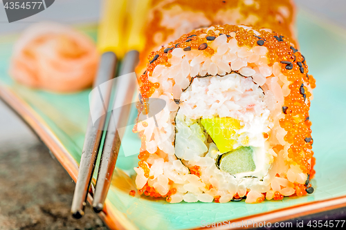 Image of California maki sushi with masago and ginger