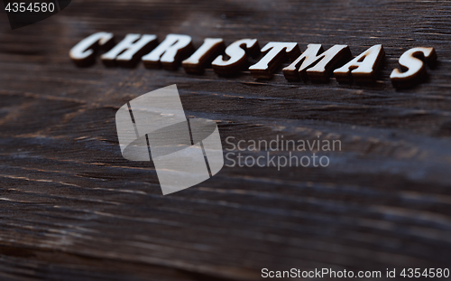 Image of Christmas text on a wooden wall