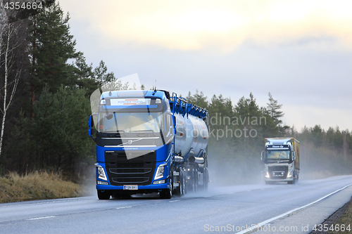 Image of Volvo FH Trucks on Wet Highway