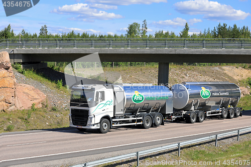 Image of Arla Milk Tank Truck on the Road at Summer