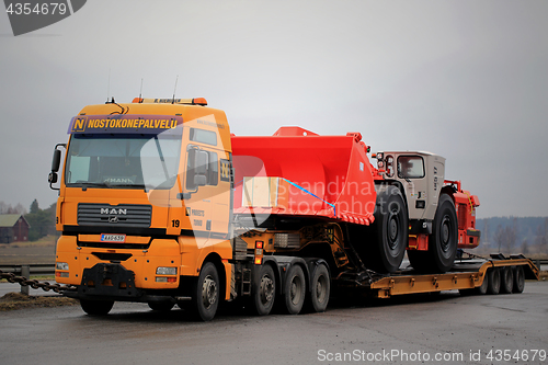 Image of MAN Semi Trailer Transports Mining Vehicle