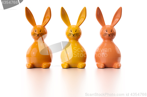 Image of three orange easter bunny figures