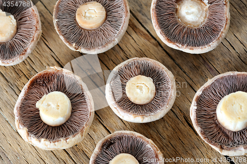 Image of Sliced mushrooms on  wooden table