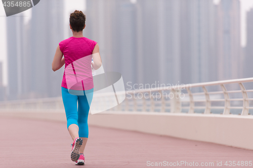 Image of woman running on the promenade