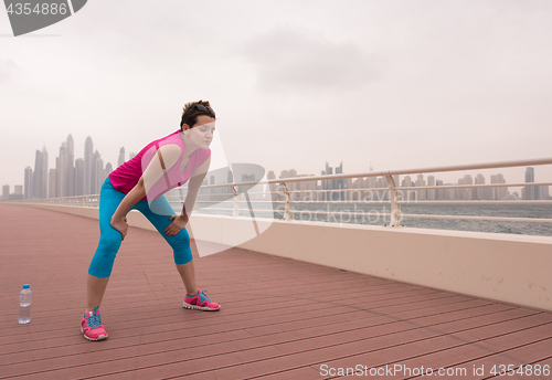 Image of woman stretching and warming up