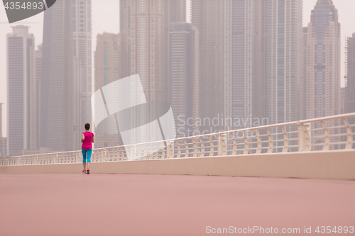 Image of woman running on the promenade