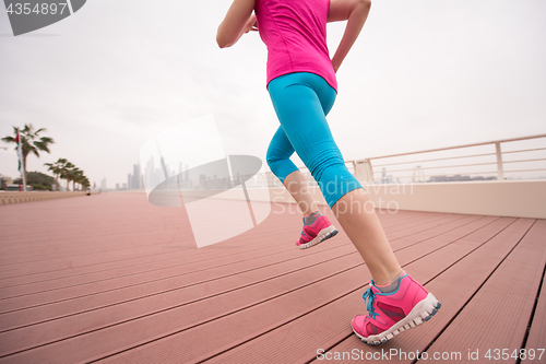 Image of woman running on the promenade