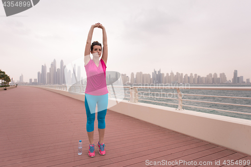 Image of woman stretching and warming up