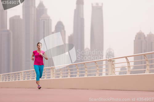 Image of woman running on the promenade