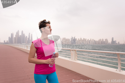 Image of young woman celebrating a successful training run