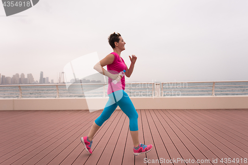 Image of woman running on the promenade