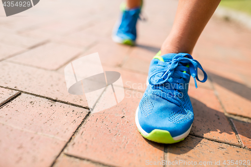 Image of Woman run in a city