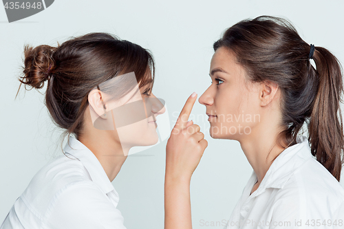 Image of Studio portrait of female twins