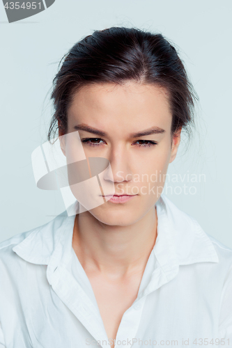 Image of The young woman\'s portrait with thoughtful emotions