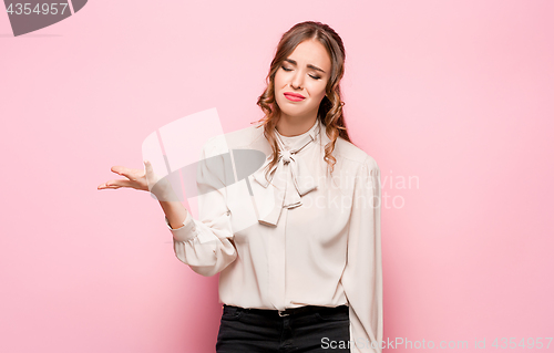 Image of Portrait of young woman with shocked facial expression