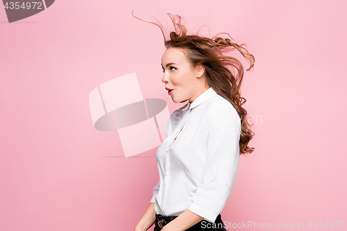 Image of Surprised happy beautiful woman looking in excitement.