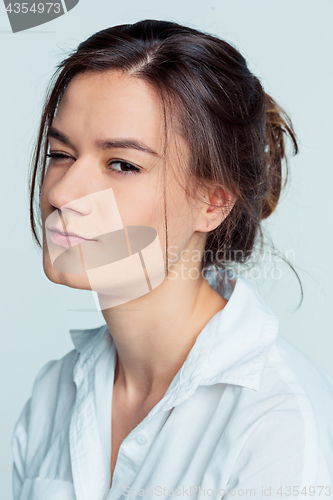 Image of The young woman\'s portrait with thoughtful emotions