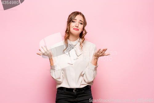 Image of Portrait of young woman with shocked facial expression