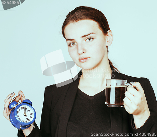 Image of young beauty woman in business style costume waking up for work 