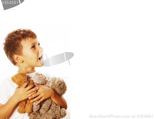 Image of little cute boy with many teddy bears hugging isolated close up