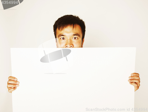 Image of pretty cool asian man holding empty white plate smiling