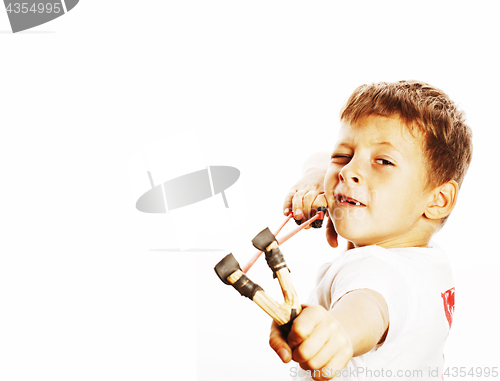 Image of little cute angry real boy with slingshot isolated