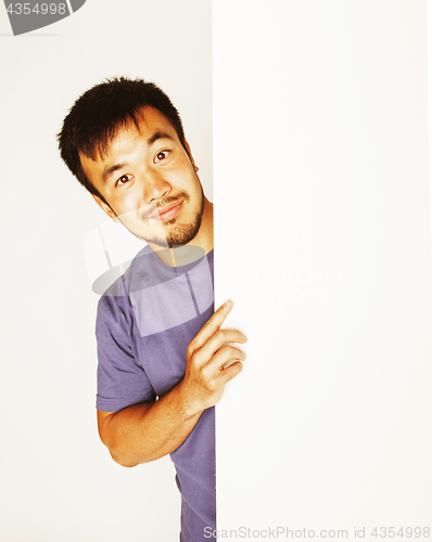 Image of pretty cool asian man holding empty white plate smiling