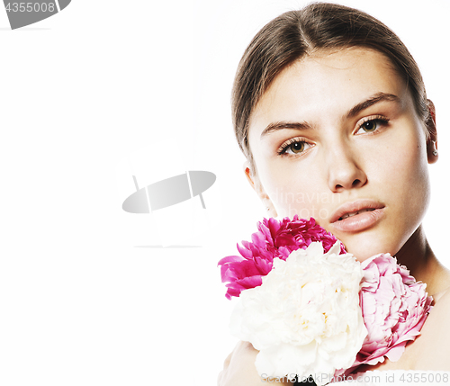 Image of young beauty woman with flower peony pink closeup makeup soft te