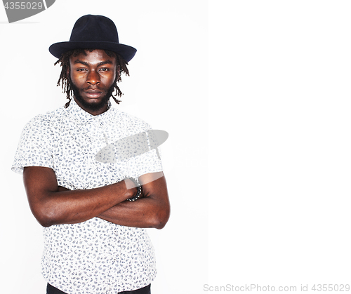 Image of young handsome afro american boy in stylish hipster hat gesturin