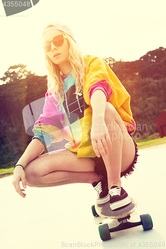 Image of Girl Riding Skateboard