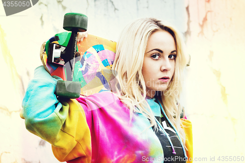 Image of Girl Holding Skateboard