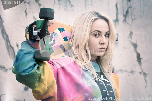 Image of Girl Holding Skateboard