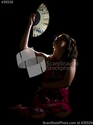 Image of Lady with feather in night