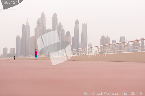 Image of woman running on the promenade