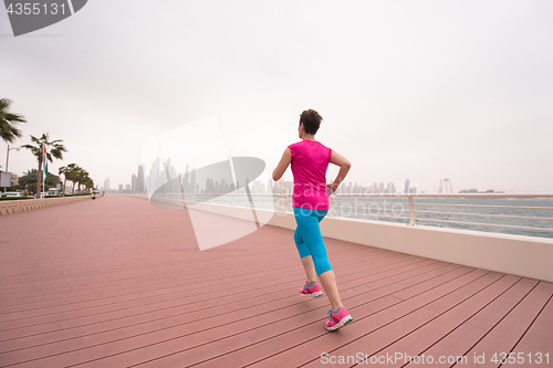 Image of woman running on the promenade
