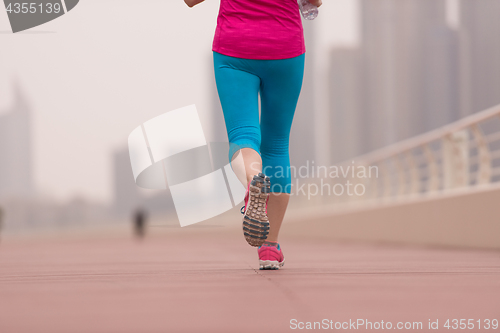 Image of woman running on the promenade