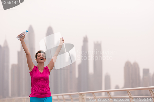 Image of young woman celebrating a successful training run