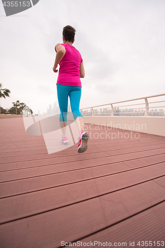 Image of woman running on the promenade