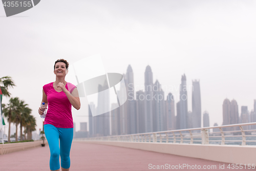 Image of woman running on the promenade