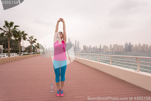 Image of woman stretching and warming up