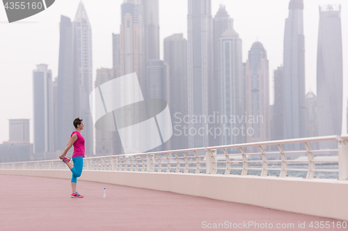 Image of woman stretching and warming up