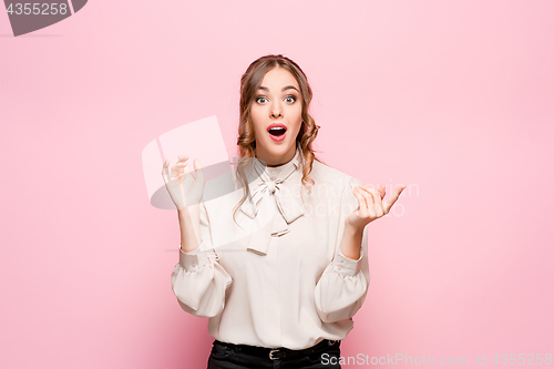 Image of Surprised happy beautiful woman looking in excitement.