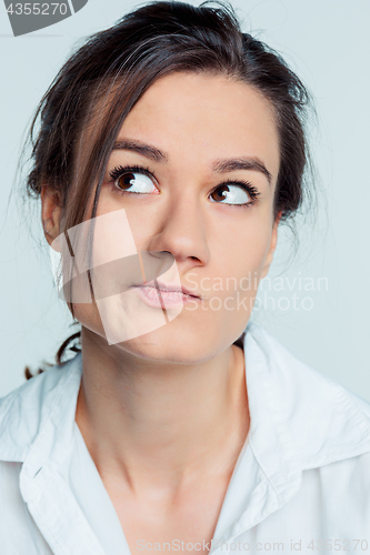 Image of The young woman\'s portrait with thoughtful emotions