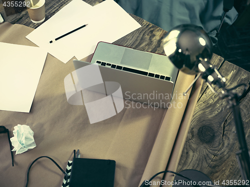 Image of Vintage hipster wooden desktop top view