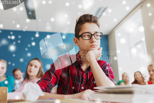 Image of students gossiping behind classmate back at school