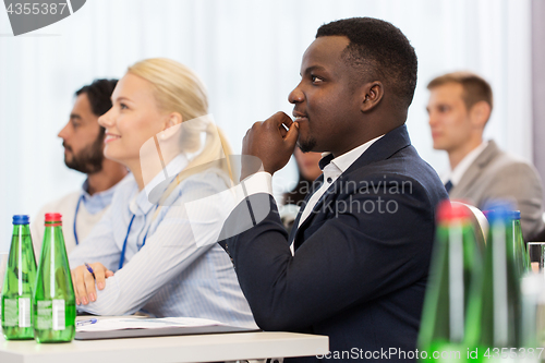 Image of happy business team at international conference