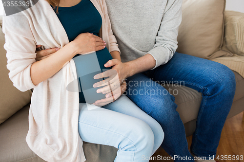 Image of close up of man and pregnant woman