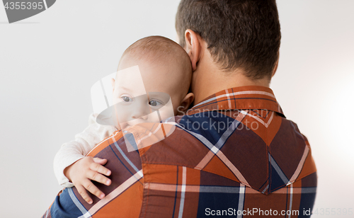 Image of close up of happy little baby boy with father