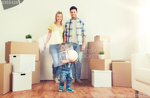 Image of happy family moving to new home and playing ball