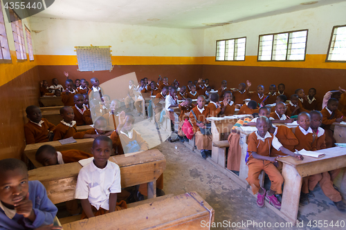 Image of Children in uniforms in primary school classroom listetning to teacher in rural area near Arusha, Tanzania, Africa.